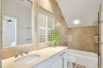 Master Suite Features a Bathtub and Shower Combo 